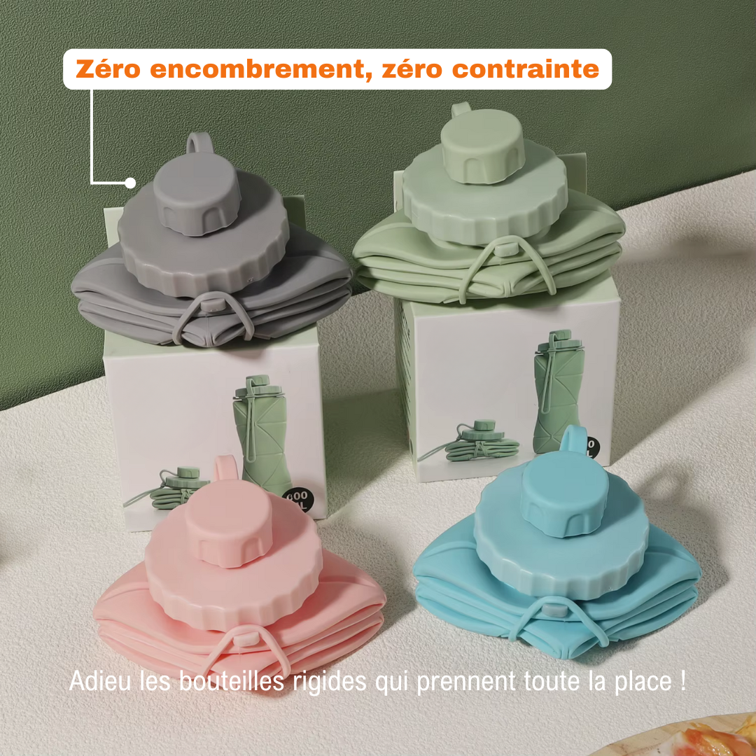 Quatre bouteilles Flexi Hydra repliées (gris, vert, rose, bleu), posées sur boîte, idéales pour un rangement sans encombrement.