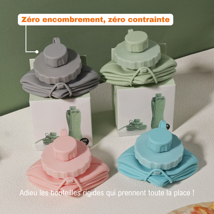Quatre bouteilles Flexi Hydra repliées (gris, vert, rose, bleu), posées sur boîte, idéales pour un rangement sans encombrement.