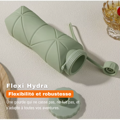 Gourde Flexi Hydra verte en silicone, ouverte et posée à plat, illustrant sa flexibilité et sa robustesse sans fuite.